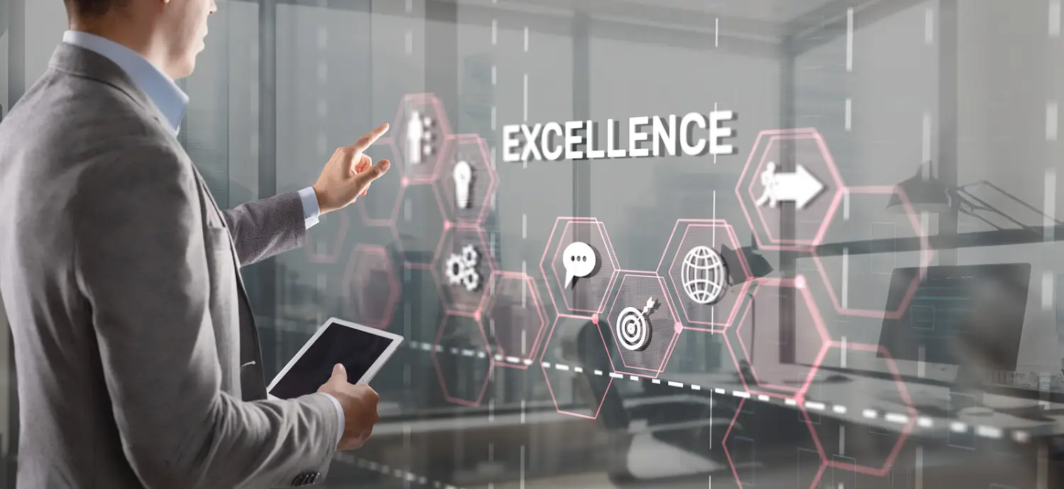 A picture of a man holding a tablet, with the text "Excellence" on